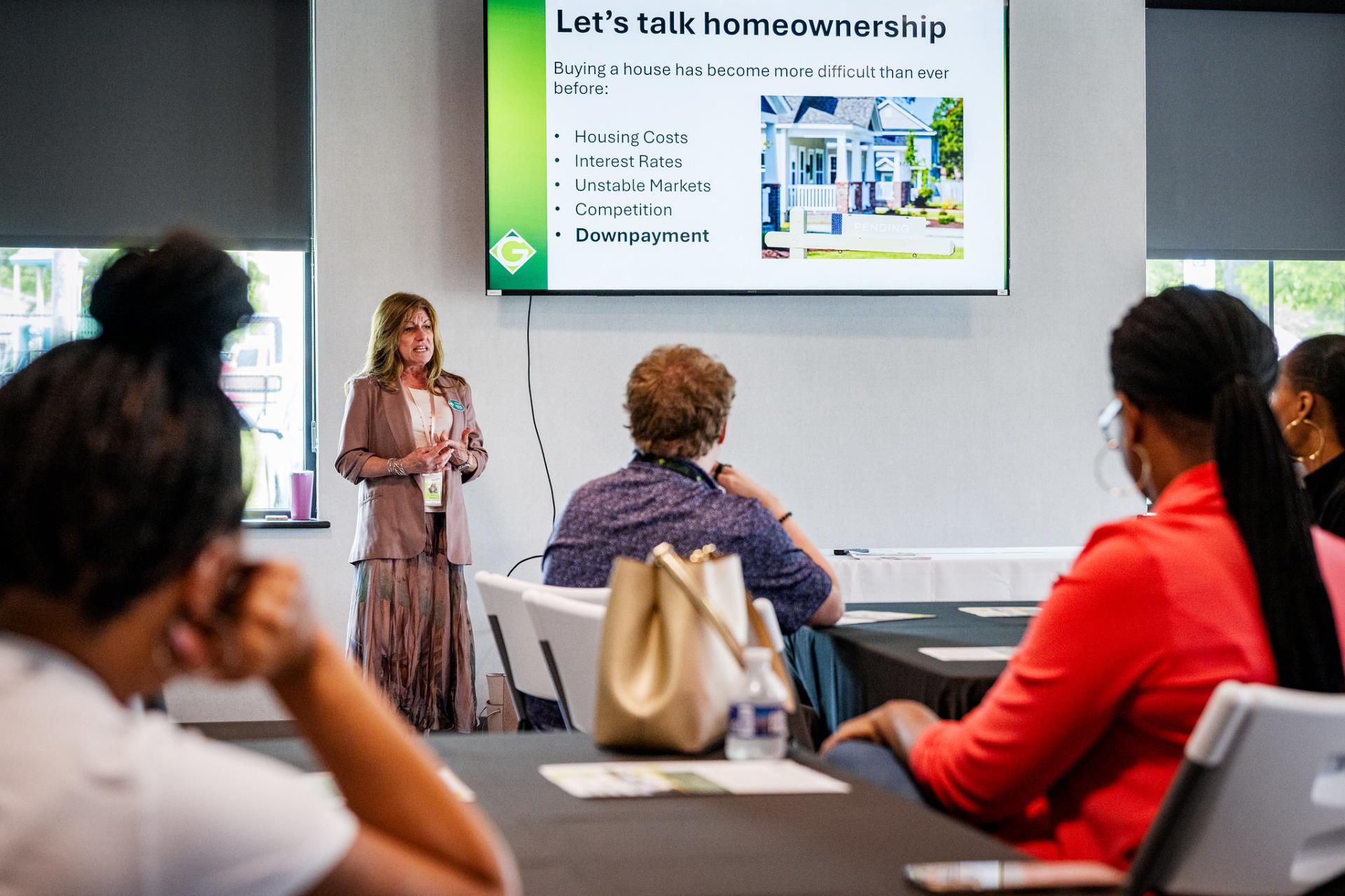 A city staff member leading a presentation on downpayment assistance for homes