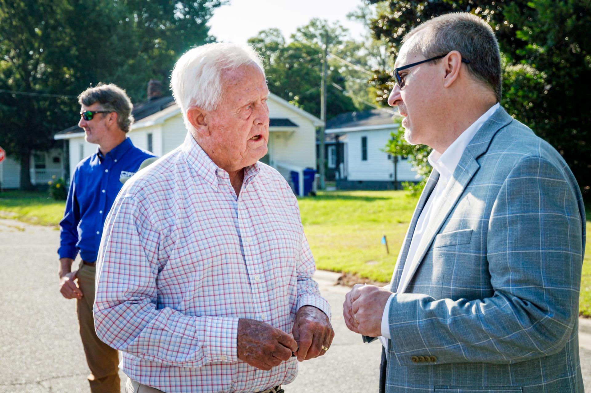 City Manager Michael Cowin talking with Parker Overton