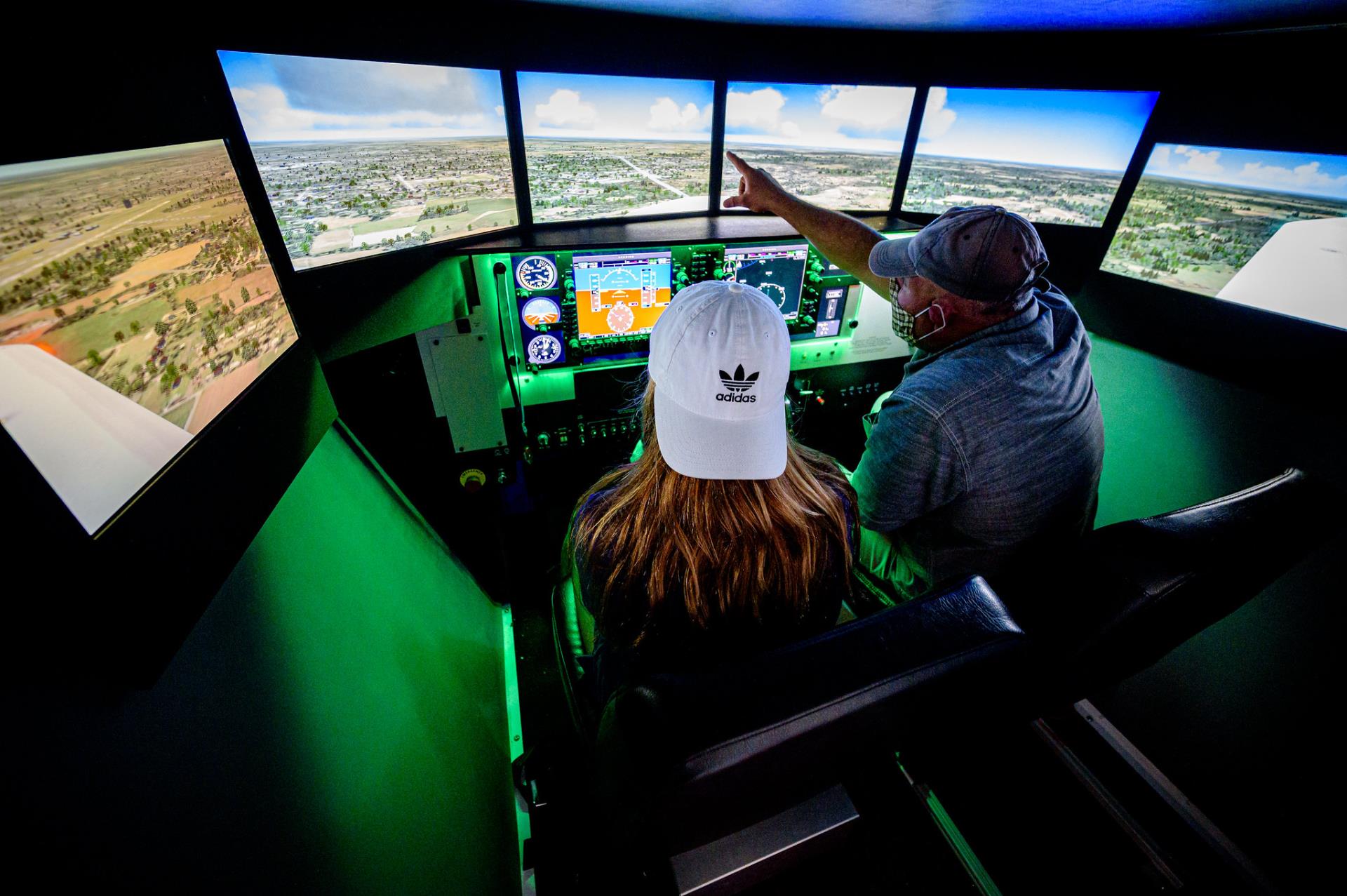 girl learning about flying at a summer camp