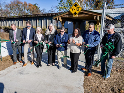 Officials cutting the ribbon on greenway