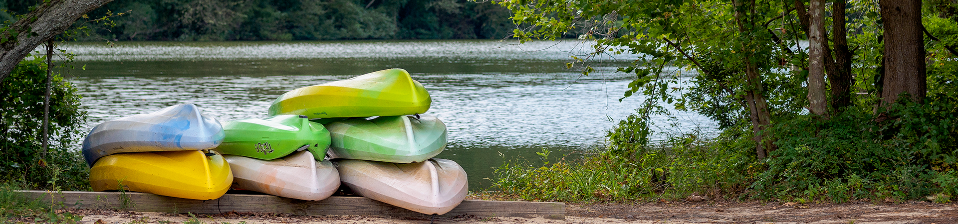 kayaks by the river