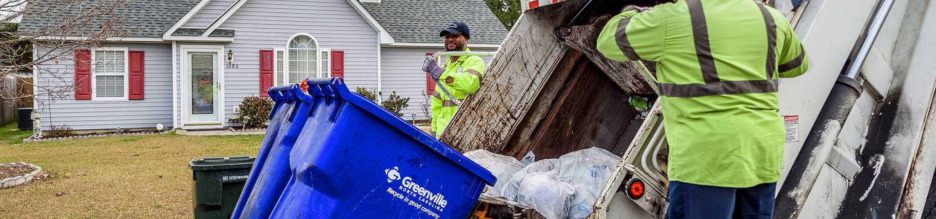 crew emptying recycling cans