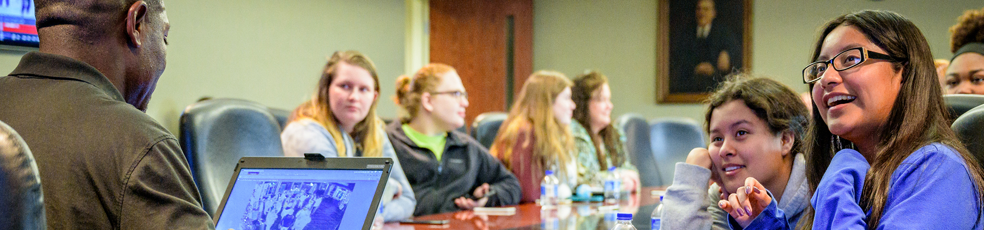 group of youth at conference table